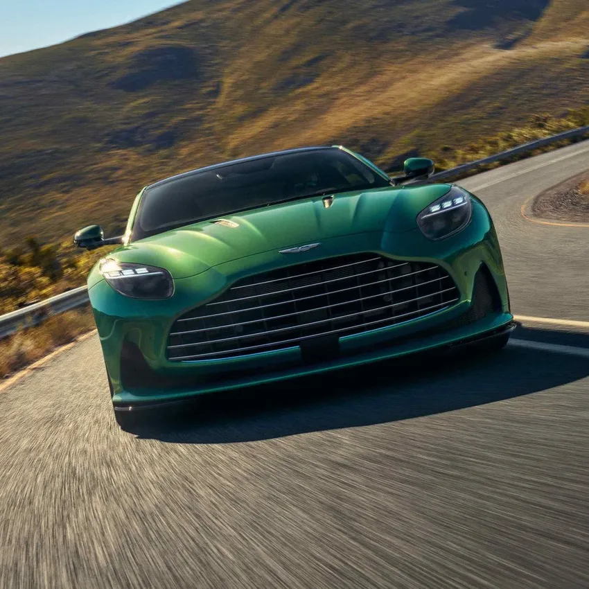 Green Aston Martin DB12 Coupe full open in milliseconds in Boston, MA